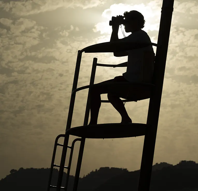 full-shot-lifeguard-with-binoculars